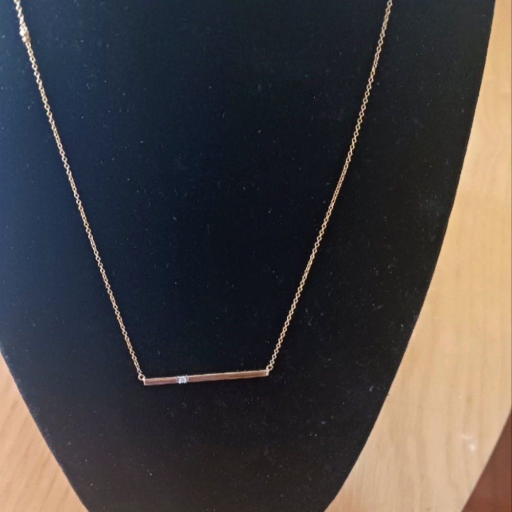 14k gold necklace with .10 diamond